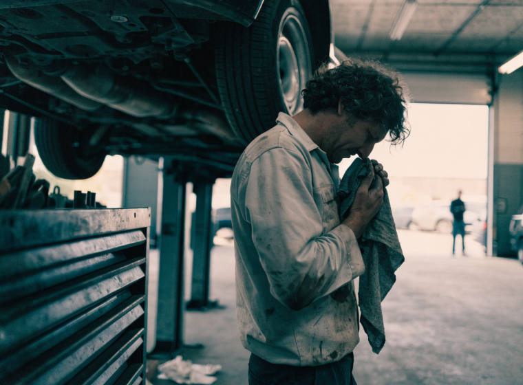Auto repair technician in a service bay