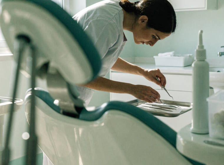 Dental hygienist preparing a treatment room